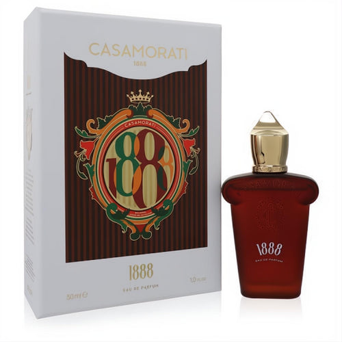 Elegant 1888 Casamorati Xerjoff 1 oz unisex Eau De Parfum. Rich amber bottle with gold cap, displayed with its ornate white and gold box.