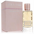 Acqua Di Parisis Bloom Velour 3.3 oz women's fragrance. Faceted glass bottle, golden liquid, rose gold cap, and blush pink box.