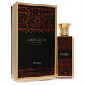 Luxurious Afnan Zimaya Grandeur unisex 3.4 oz Eau De Parfum. Black bottle and box with striking gold and vibrant tribal patterns.