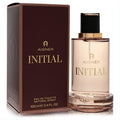 Sophisticated Aigner Initial men's Eau De Toilette 3.4 oz spray. Clear bottle, gold liquid, black cap, and rich brown box with gold branding.