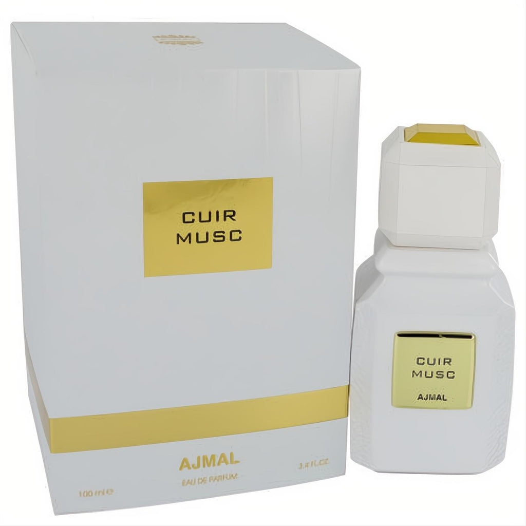 Ajmal Cuir Musc 3.4 oz unisex EDP. Modern white bottle with gold label and cap, next to its sleek matching white and gold box.