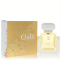 Stunning Ajmal Oath women's 3.4 oz Eau De Parfum. Clear bottle with yellow liquid, white cap, and elegant gold-white geometric box.