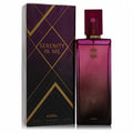 Ajmal Serenity In Me 3.4 oz EDP. Elegant magenta gradient glass bottle with gold details and a luxurious dark purple geometric box.