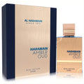 Al Haramain Amber Oud Bleu Edition 6.7 oz men's fragrance. Elegant gold metallic bottle and box with striking deep blue accents.
