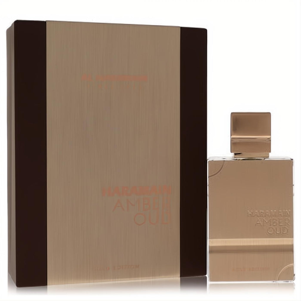 Luxurious Al Haramain Amber Oud Gold Edition 2 oz unisex perfume bottle and sleek gold box, exuding sophistication.