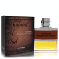 Captivating Al Haramain Khulasat Al Oud 3.4 oz unisex EDP. Sleek glass bottle with golden liquid, rich wood-grain box.