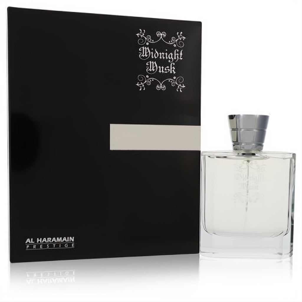 Al Haramain Midnight Musk 3.4 oz unisex EDP. Sleek clear glass bottle with silver cap, next to its elegant black and silver box.