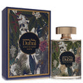 Elegant Al Haramain Palm Dubai Extrait De Parfum 3.3 oz. Gold-capped bottle & blue box with lush tropical leaf pattern.