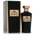Amouroud Dark Orchid fragrance. Sophisticated black faceted bottle with a radiant gold cap and label, alongside its matching black and gold box.