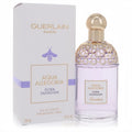Guerlain Aqua Allegoria Flora Salvaggia 4.2 oz EDT. Clear bottle with delicate purple liquid, gold honeycomb cap, and elegant white bee-adorned box.