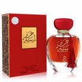 Exquisite Arabiyat Lamsat Harir 3.4 oz EDP. Luxurious red and gold bottle with tassel, matching box, and elegant Arabic script.
