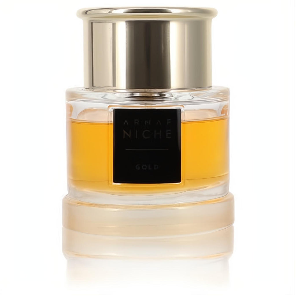 Armaf Niche Gold women's perfume in a clear glass bottle with radiant golden liquid, sleek black label, and polished gold cap.