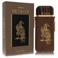 Luxurious Armaf The Falcon unisex EDP 3.4 oz. Brown leather-sleeved bottle with gold falcon design and wood-grain cap, beside matching box.