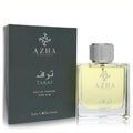 Azha Taraf 3.3 oz men's Eau de Parfum. Clear glass bottle with amber liquid, textured silver cap, and sleek dark grey box.