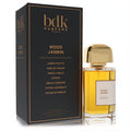 Luxurious Bdk Wood Jasmin Eau De Parfum spray, 3.4 oz, in a clear bottle with gold cap, beside its elegant black and gold box.