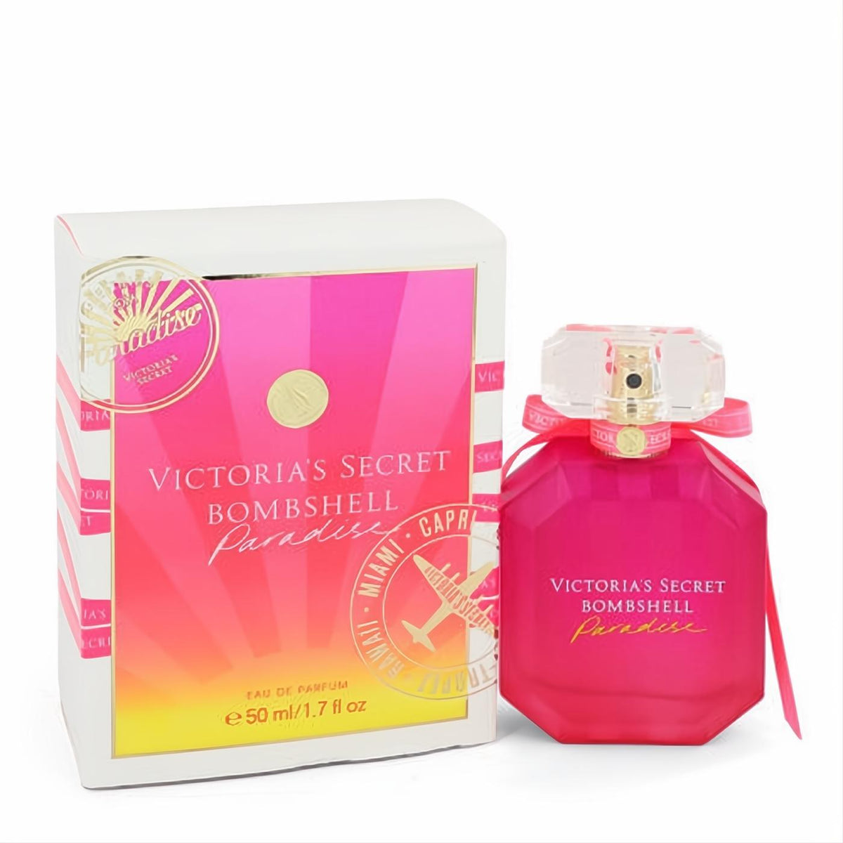 Vibrant fuchsia Victoria's Secret Bombshell Paradise 1.7 oz EDP. Octagonal bottle with gold atomizer, pink ribbon, tropical box.