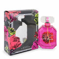 Victoria's Secret Bombshell Wild Flower 3.4 oz EDP. Dazzling pink faceted bottle with a clear cap and elegant floral box.