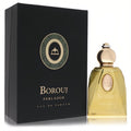 Exquisite Borouj Perlador Eau De Parfum. Golden fragrance in a clear glass bottle with a gold cap, next to its elegant black and gold box.