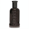 Bold Boss Bottled United 3.3 oz men's fragrance. Sleek, glossy dark grey bottle with prominent BOSS branding.