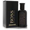 Luxurious Boss Bottled by Hugo Boss Parfum 3.4 oz spray. Dark glass bottle with embossed gold logo, paired with its elegant matching box.
