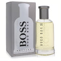 Hugo Boss Bottled men's EDT spray, 3.3 oz. Clear bottle with light yellow fragrance, grey cap, and sleek grey box.