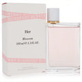 Elegant Burberry Her Blossom 3.3 oz EDT spray, featuring a clear glass bottle with light pink fragrance and its iconic white box.