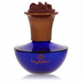 Elegant Byblos Eau De Parfum spray bottle with a vibrant blue glass base and a distinctive bronze floral cap.