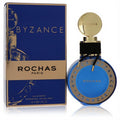 Experience Rochas Byzance 2019 Edition 1.3 oz EDP. Stunning deep blue round glass bottle, gold cap, and elegant black cord.