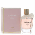 Cabochard Cherie 3.4 oz EDP: Elegant clear glass bottle with soft pink liquid, gold cap, and delicate cream ribbon, beside its chic pink and gold box.