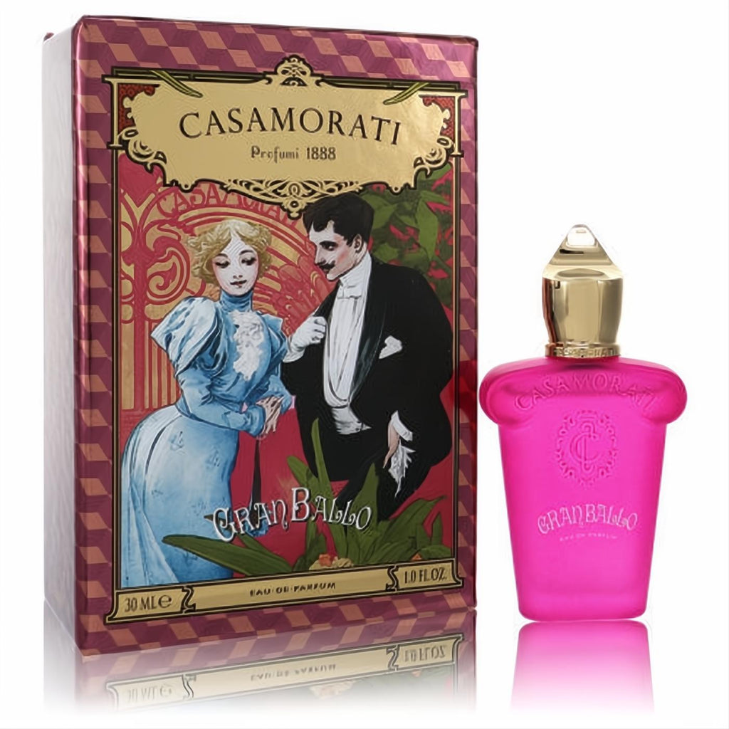 Vibrant pink Casamorati Gran Ballo 1 oz EDP bottle, topped with a golden cap, next to its ornate vintage-illustrated red and gold box.