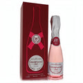 Luxurious Bharara Beauty Champagne Pink EDP spray for women. 3.4 oz pink champagne bottle with silver foil and a red gift box.