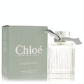 Elegant Chloe Naturelle 3.3 oz EDP spray. Clear fluted glass bottle with chic grey ribbon, beside its signature sage green box.