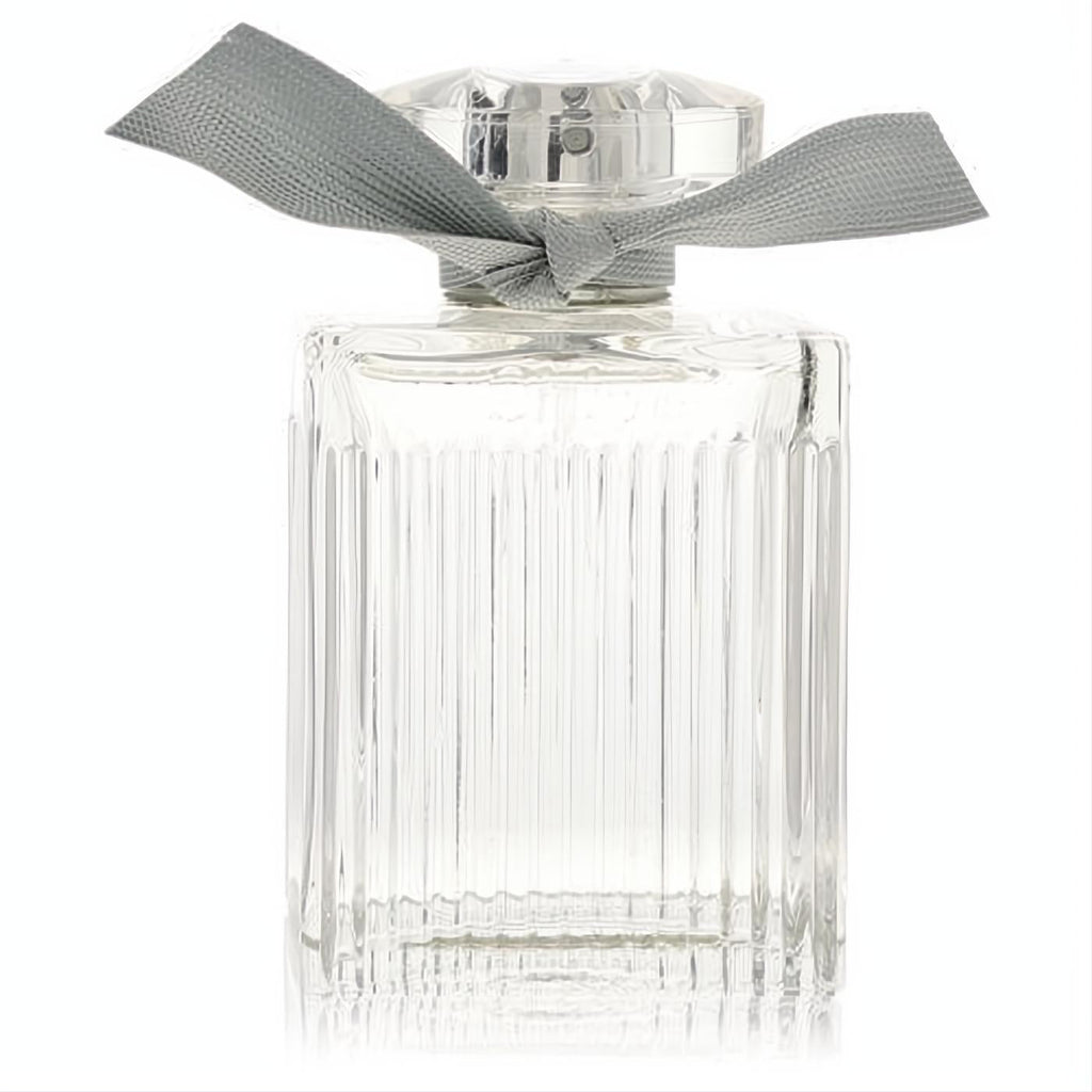 Chloe Naturelle 3.3 oz women's EDP. Clear ribbed glass bottle with elegant vertical lines, faceted cap, and stylish grey ribbon.