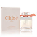 Chloé Rose Tangerine 2.5 oz Eau De Toilette. Elegant clear ribbed bottle with a chic peach ribbon, beside its matching soft pink box.