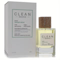 Clean Reserve Smoked Vetiver 3.4 oz Eau de Parfum. Clear glass bottle, natural wood cap, and sleek white box.