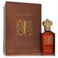 Clive Christian I Woody Floral 1.6oz perfume bottle with ornate gold crown cap next to its elegant brown box.