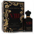 Luxurious Clive Christian VIII Rococo Magnolia 1.6 oz perfume. Black bottle with red VIII, gold accents, and a regal crown cap, beside its ornate black and gold box.