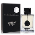 Armaf Club De Nuit Urban Man 3.4 oz EDP. Elegant black box and clear bottle with light amber liquid, bold black cap, and chain detail.