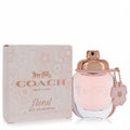 Elegant Coach Floral 10 ML Eau De Parfum spray, featuring a charming pink bottle with rose gold cap and floral charm, beside its matching floral box.