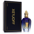 Xerjoff Commandante 3.4 oz unisex EDP. Striking blue-gold gradient bottle with ornate gold cap, next to its elegant dark blue box.