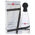 Coty Pret A Porter 3.3 oz Eau De Toilette. Elegant clear glass bottle with black spray top and "Paris New York" band, next to its sleek white box.