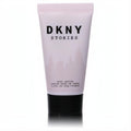 DKNY Stories 1.0 oz body lotion. Chic light pink squeeze tube with bold black text, perfect for modern women.