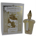 Exquisite Dama Bianca Xerjoff 3.4 oz women's Eau De Parfum. Frosted bottle, gold cap, white tassel, and ornate white & gold Casamorati box.