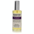 Demeter Patchouli 4 oz cologne spray. Clear glass bottle, golden liquid, sleek silver sprayer, and distinctive purple label.