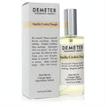 Indulge in Demeter Vanilla Cookie Dough 4 oz unisex cologne. Clear glass spray bottle, silver cap, and sleek white box with beige accent.