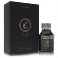 Dumont Celerio Oros unisex Eau De Parfum, 3.4 oz. Distinctive dark glass bottle with a silver cap and elegant matte black box.