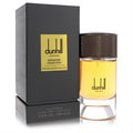 Dunhill Indian Sandalwood 3.4 oz EDP for men. Elegant black box and clear bottle with rich amber fragrance, featuring a textured black cap.