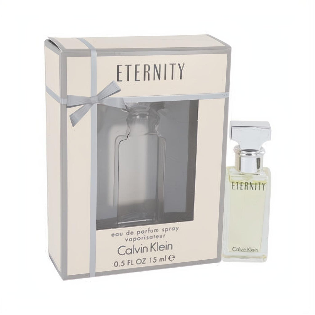 Timeless Calvin Klein Eternity .5 oz Eau de Parfum spray in a clear glass bottle with silver cap, beside its elegant beige box.