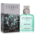 Calvin Klein Eternity Reflections for Men 100ml EDT. Captivating teal glass bottle with a sleek silver cap, next to its shimmering dark box.