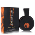 Distinctive black Exclamation Wild Musk perfume bottle with unique angular cap and vibrant orange abstract art, beside its tiger-stripe box.